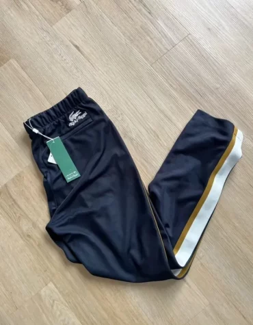 Pantalon en piqué Lacoste x Ricky Regal à bandes contrastées